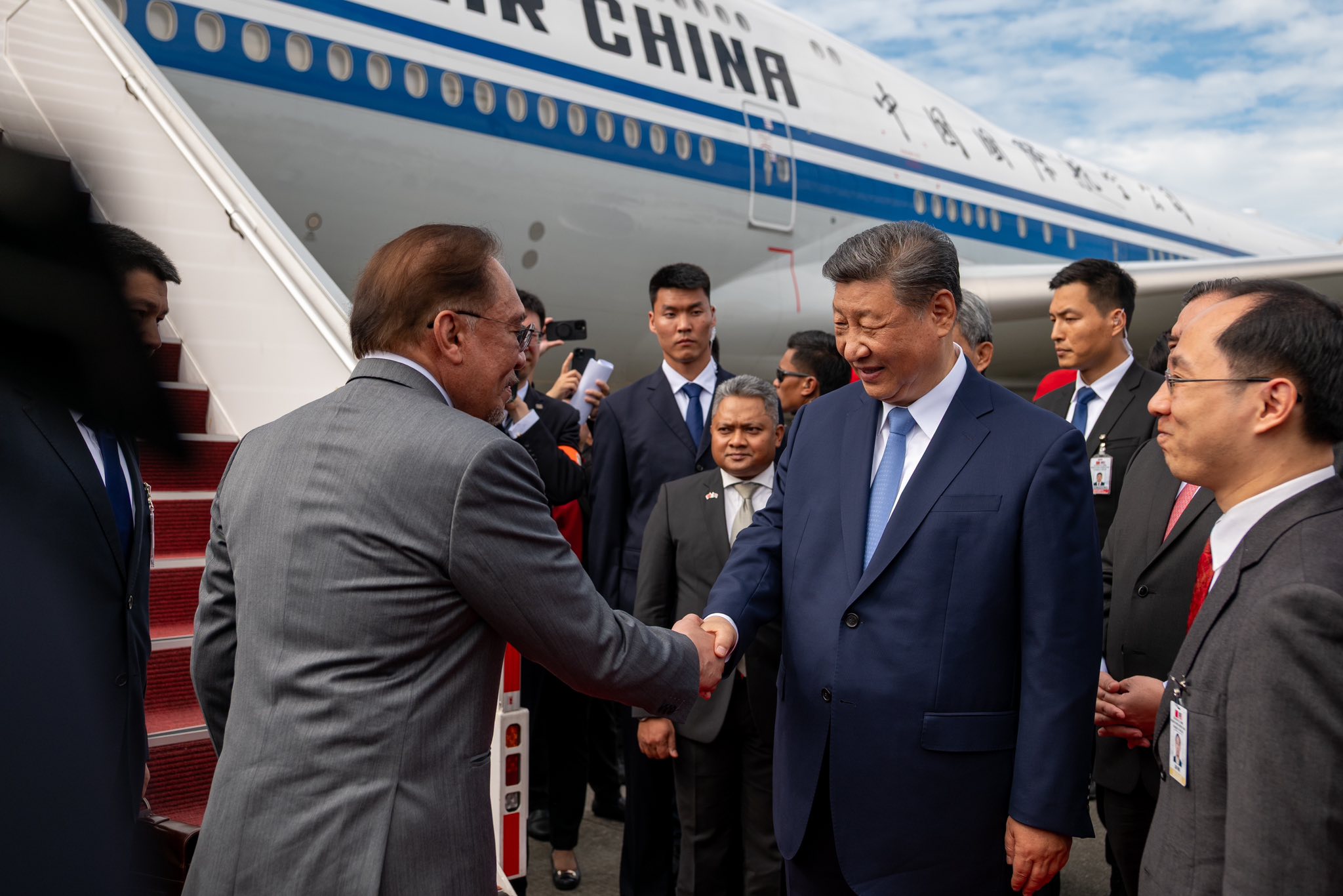 Xi