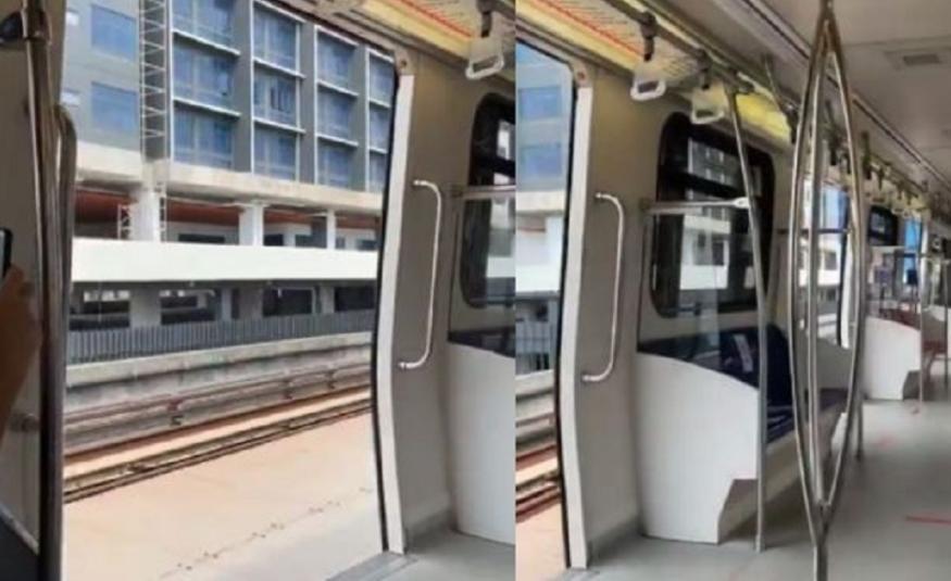 Pintu LRT terbuka ketika bergerak